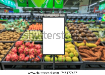 Blank billboard and blurred supermarket fruits background