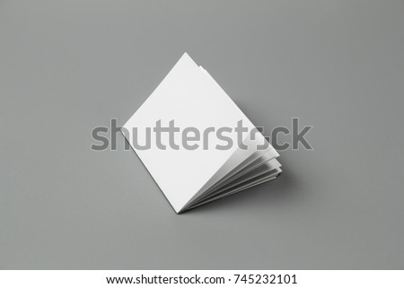 Blank portrait A4. brochure magazine isolated on gray, changeable background. white paper isolated on gray