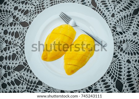 Fresh slices of ripe mangoes are the best tropical seasonal fruits.
