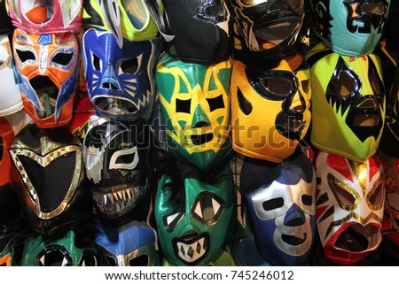 A selection of colorful "Lucha Libre" Mexican professional wrestling masks, for sale outside of Arena Mexico, Mexico City