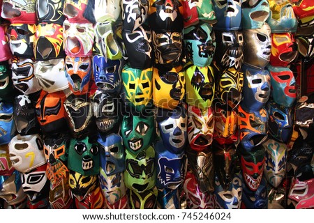 A selection of colorful "Lucha Libre" Mexican professional wrestling masks, for sale outside of Arena Mexico, Mexico City Royalty-Free Stock Photo #745246024