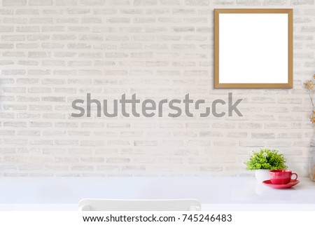 Mock up : Stylish minimalistic white table workplace with supplies ,red coffee cup and houseplant. copy space for product display montage.