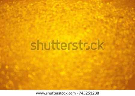 Golden yellow color abstract background can be use as wallpaper screen saver for Christmas card background or valentine card background. The background show light bokeh which on defocused light.
