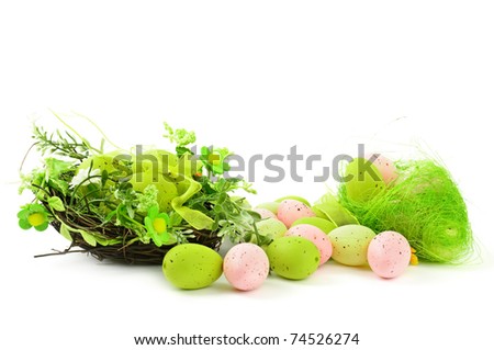 decorative easter nest with egg and spring plants isolated on white background