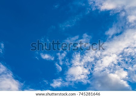 Bright Fume clouds in deep blue sky