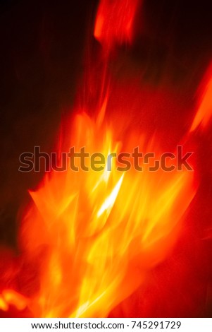 Fire Flames With Motion Blur Effect On Black Background