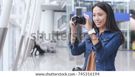 Traveler woman taking photo with camera 
