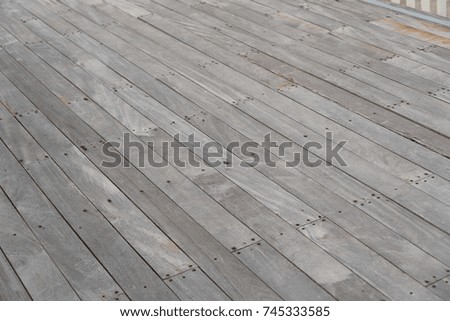 Old gray wooden board Use as a walkway in the garden.