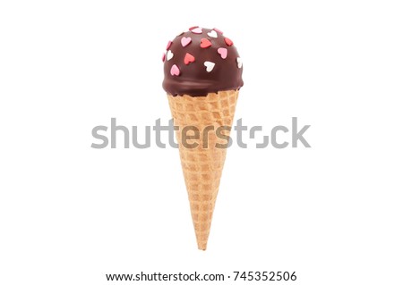 Chocolate cake pop in waffle cone for ice cream, decorated with pink and white confectionery sprinkles in the form of heart. Isolated. Picture for a menu or a confectionery catalog.