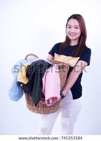 Beautiful young housewife holding clothing basket isolated on white background., Hold a laundry basket to wash.Tired