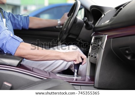 Driver's hand on gear lever