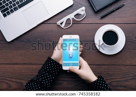 Man holding phone in hand. Digital technology. Innovative implementation in business. Internet applications. Tablet phone and camera. Developing applications on the Internet. Flat lay photo
