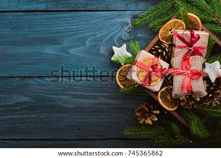 Christmas wooden background with snow fir tree and decoration. Top view with copy space for your text.