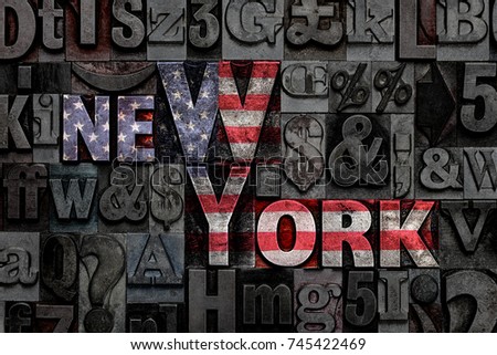 The words New York made from old metal letterpress letters with the colours of the American flag