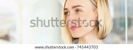 Blonde beauty businesswoman portrait look at camera on window background