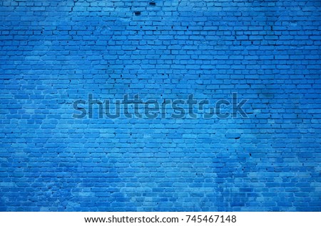 The texture of the brick wall of many rows of bricks painted in blue color Royalty-Free Stock Photo #745467148