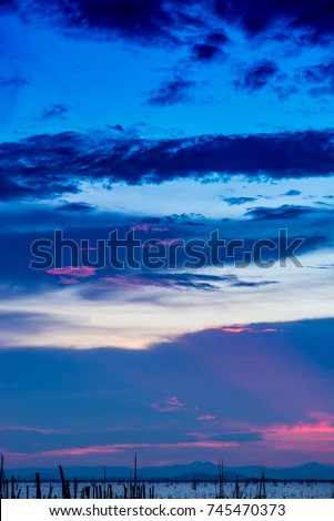 Blue sky with white and blue and pink clouds. Clear sky. Beautiful sky.