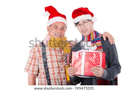 Father gave a gift to his son on Christmas Eve.Isolated on white background.