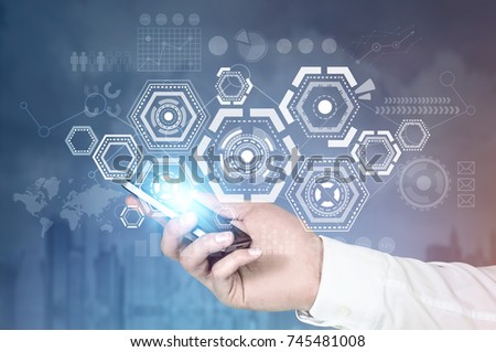 Hand of a businessman with a smartphone. HUD and infographics, data presentation. Blurred city background. Toned image double exposure mock up. Elements of this image furnished by NASA