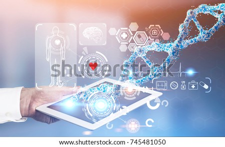 Man s hand with a digital tablet near a medical HUD and DNA against a blurred background. Toned image double exposure