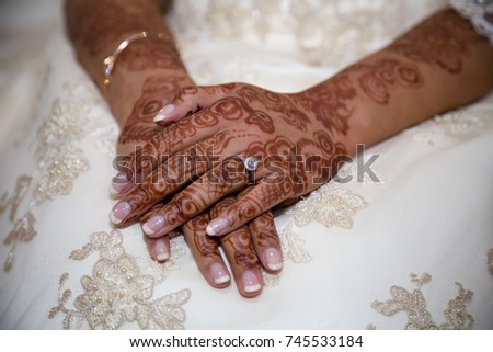 Bride crossed hands showing henna