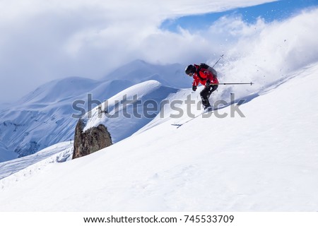 Skiing in the snowy mountains, good winter day, ski season.
