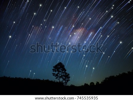 Rotating star galaxy mountain night blue sky tree