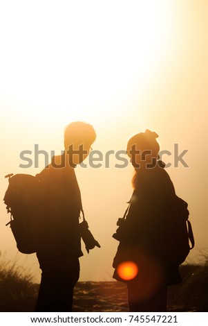 Backpack Lover Men and women Walking hold one's hands Up the Mountain See the sunrise in the morning With camera travel Adventure Phucheefah thailand