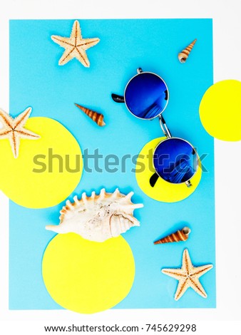 Minimalist fashion photo. Top view of essential modern young lady or girl on vacations.Woman's summer holidays accessories composed on pastel color background. Beach fashion , summer concept