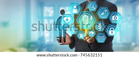 Unrecognizable data administrator accessing a patient personal health record. Information technology and healthcare concept for electronic medical reporting system, remote access to health records. Royalty-Free Stock Photo #745632151