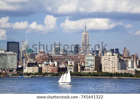 The view of boat passing by with Manhattan skyline behind (New York City). 