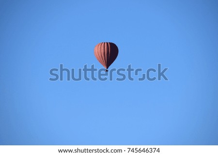 Hot Air Balloon in Blue Sky Royalty-Free Stock Photo #745646374