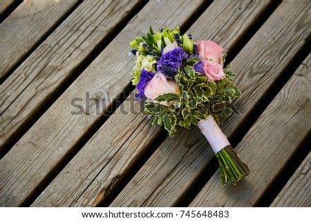 
bouquet of the bride on the background of a tree