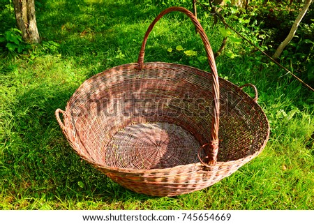 Traditional woven wicker baskets for sale on regional market. Close up, selective focus, vertical composition.