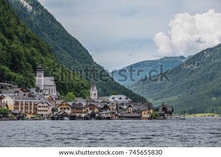 beautiful view of Hallstat -  Alpine paradise village in the lakeside with Alp mountains and blue cloudy sky background from in Austria