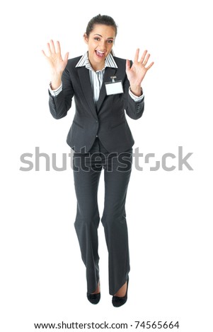 happy businesswoman dance, attractive brunette in grey suit isolated on white background