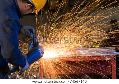 Factory worker using electric grinder - a series of METAL INDUSTRY images.