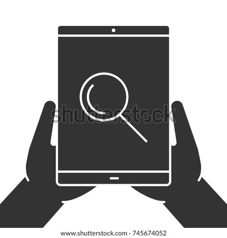Hands holding tablet computer glyph icon. Silhouette symbol. Tablet computer with magnifying glass. Negative space. Raster isolated illustration