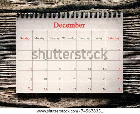 December 25 in the calendar on the wood background 