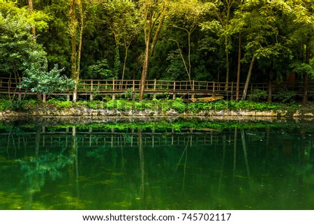 small lake and wooden bridge at Zhangjiajie national forest park, Wulingyuan, Hunan, China