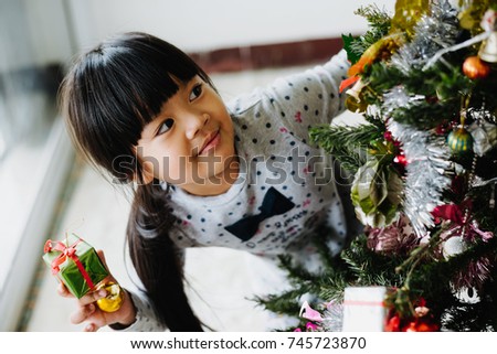 Cute little girl having fun with celebration in festival new year, The smile of a child.