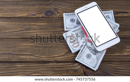 Concept phone and money on a tree background. The idea of business, gadget, smartphone application. Isolated white phone screen