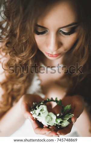 Portrait of beautiful bride with fashion veil at wedding morning. Wedding dress.