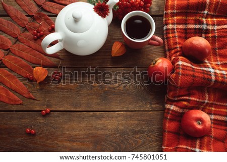 Hot drink on a cold autumn day. Warmth and coziness. Fall harvest concept