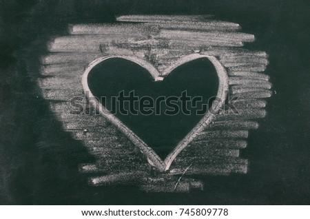 Heart on chalkboard, blackboard texture