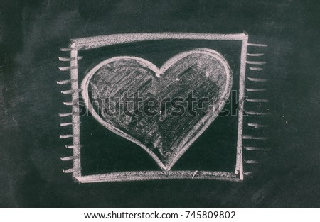Heart in box on chalkboard, blackboard texture