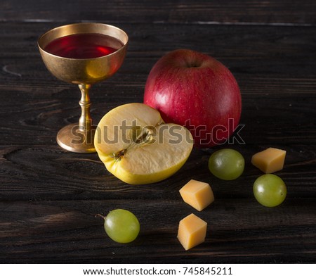 Vintage dishes with grape, apple and wine in the glass