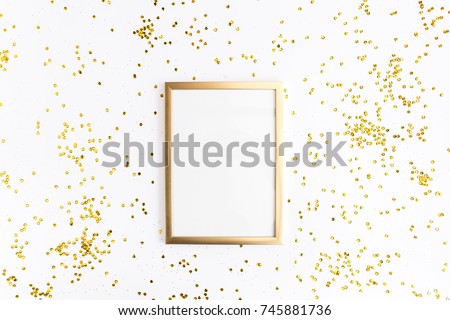 Photo frame mock up with space for text, golden confetti on white background. Lay Flat, top view. Valentine's minimal background. Royalty-Free Stock Photo #745881736