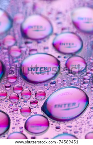 "Enter" in water drops. Close-up od studo shot.