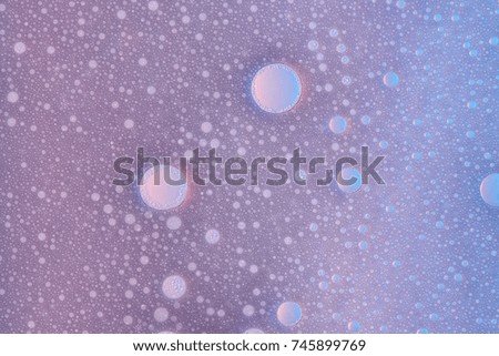 Abstract foam bubble texture on violet water background